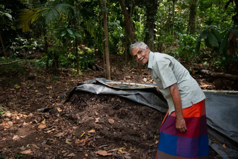 A farmer showing his organic fertiliser stock - Kandy, Sri Lanka