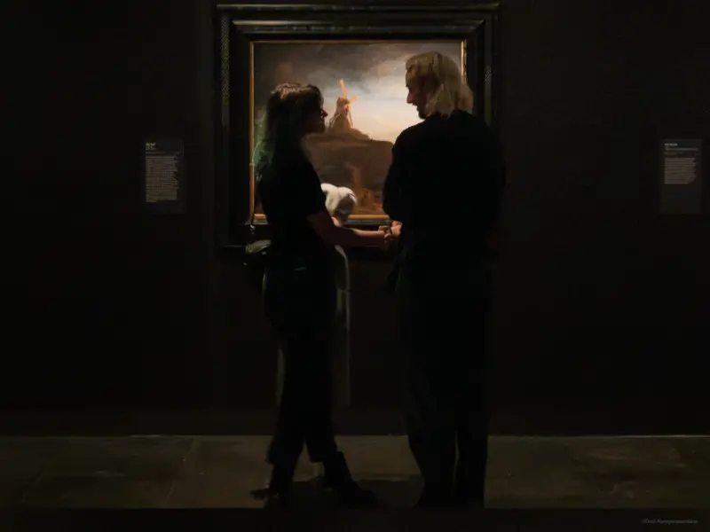 A couple in front of ‘The Mill’ by Rembrandt - 'Rembrandt true to life' Exhibition - National Gallery of Victoria (NGV), Melbourne, Australia
